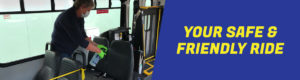Photo of a driver sanitizing a bus seat